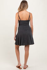 Charcoal solid ribbed knit maternity mini dress with adjustable straps.