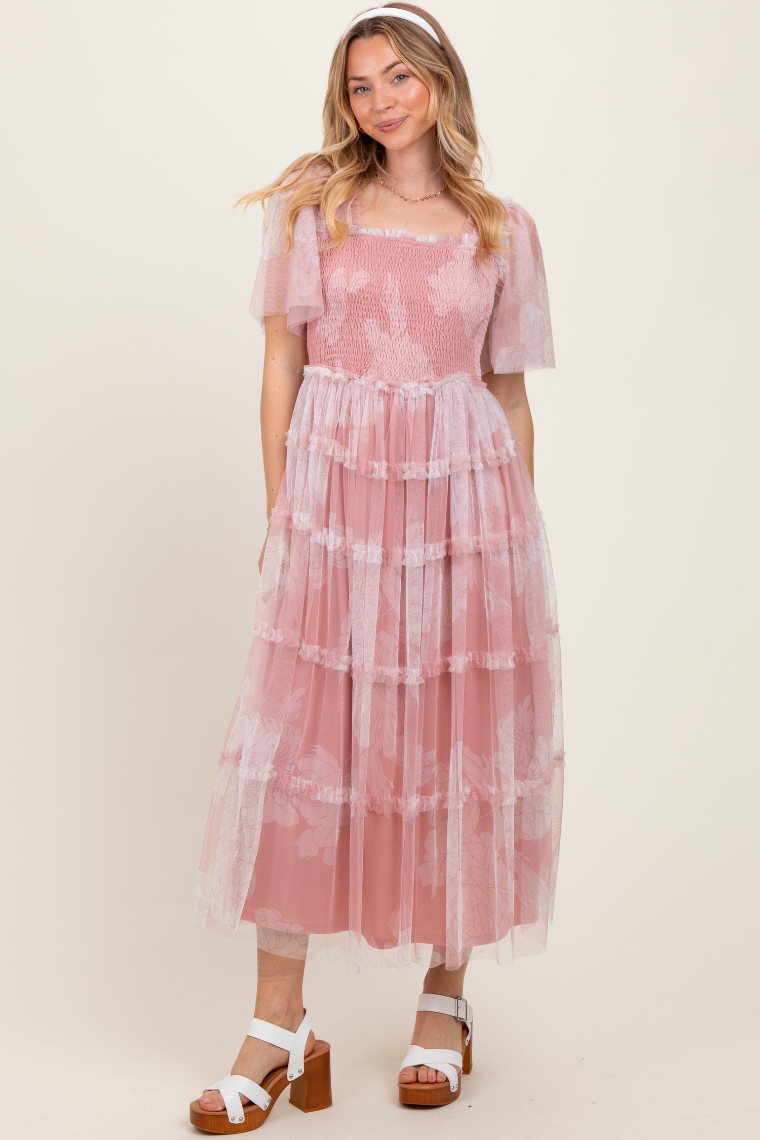 Pink mesh midi dress with smocked bodice, sheer puff sleeves, and soft ruffled tiered skirt