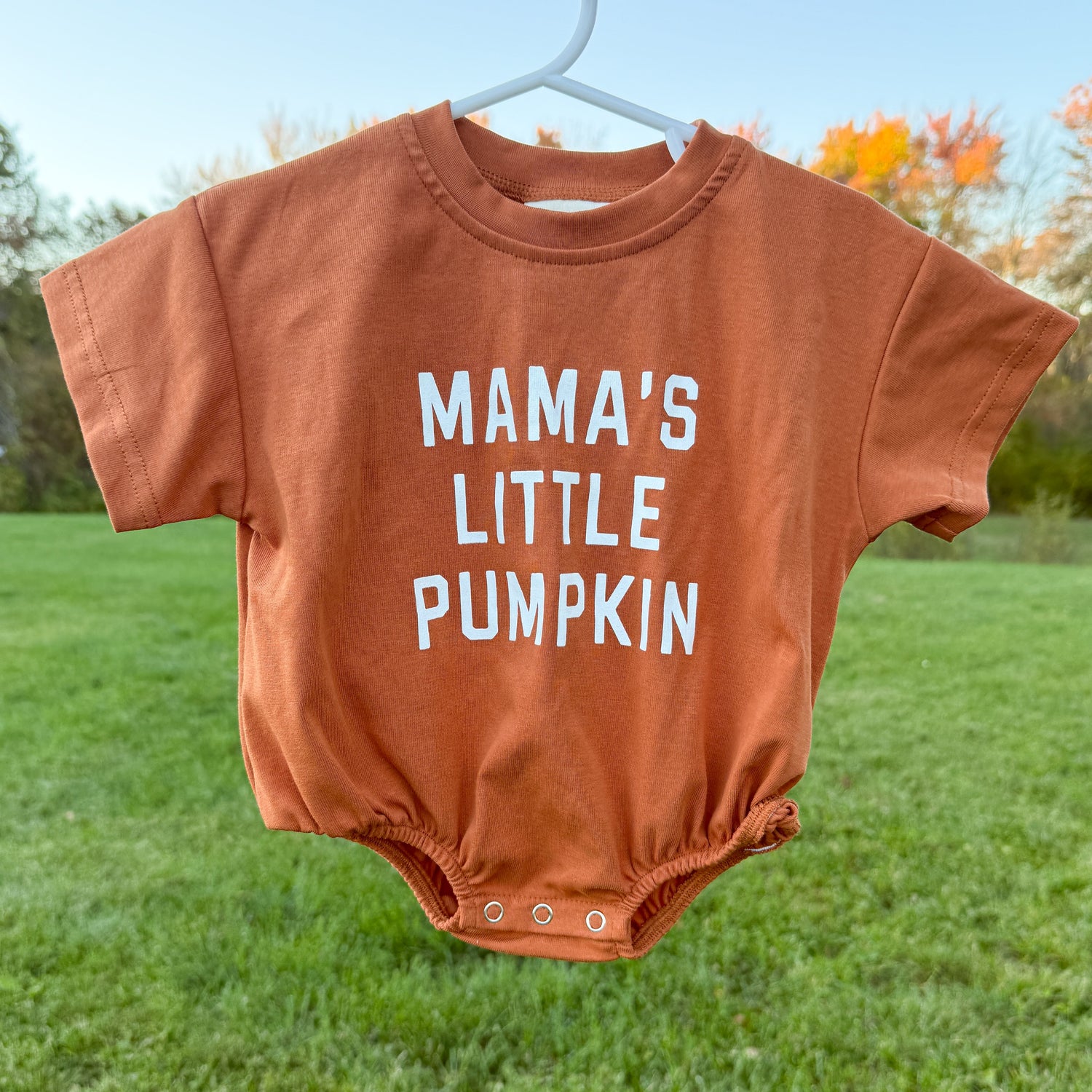 Bubble romper with "Mama's Little Pumpkin" screenprinted graphic and snap closures at the crotch