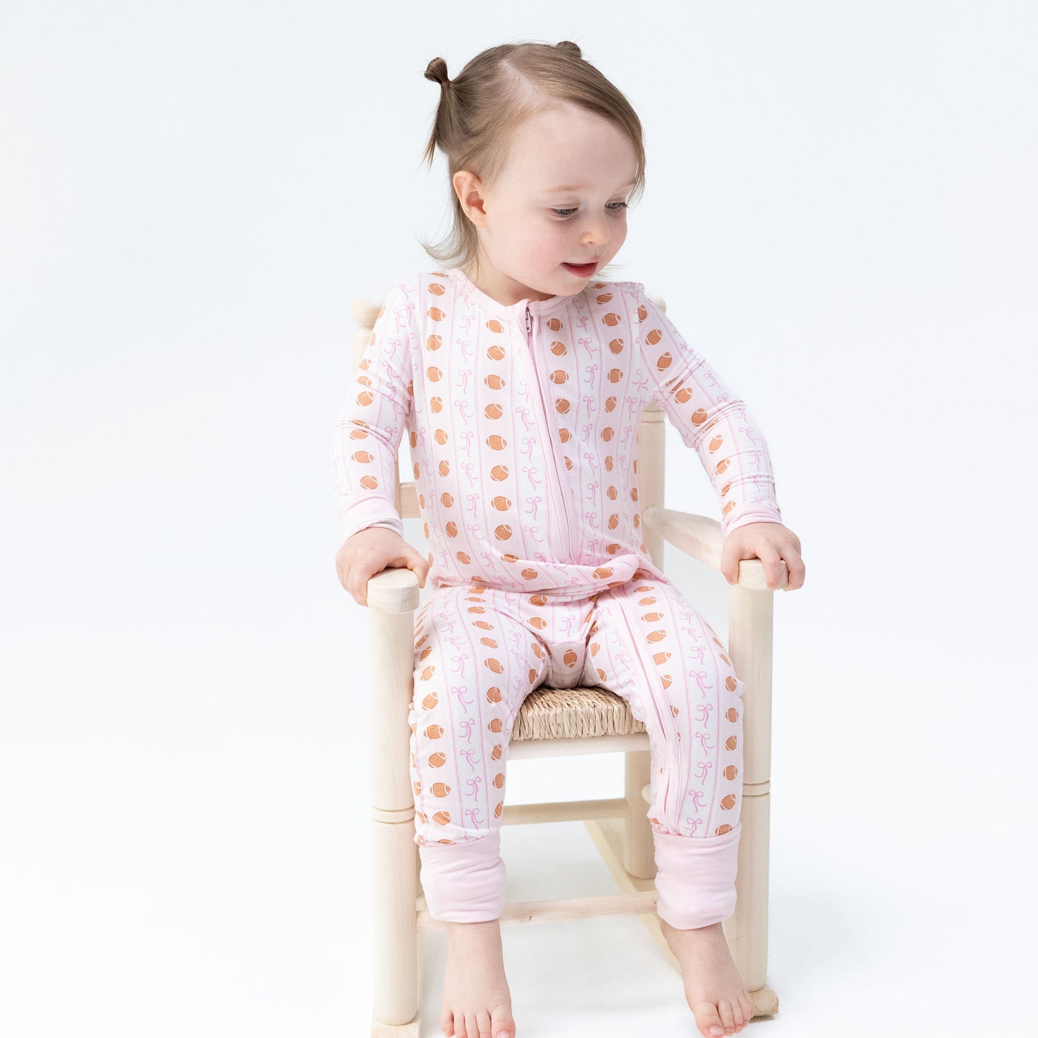 Convertible romper with football stripe print and zipper front
