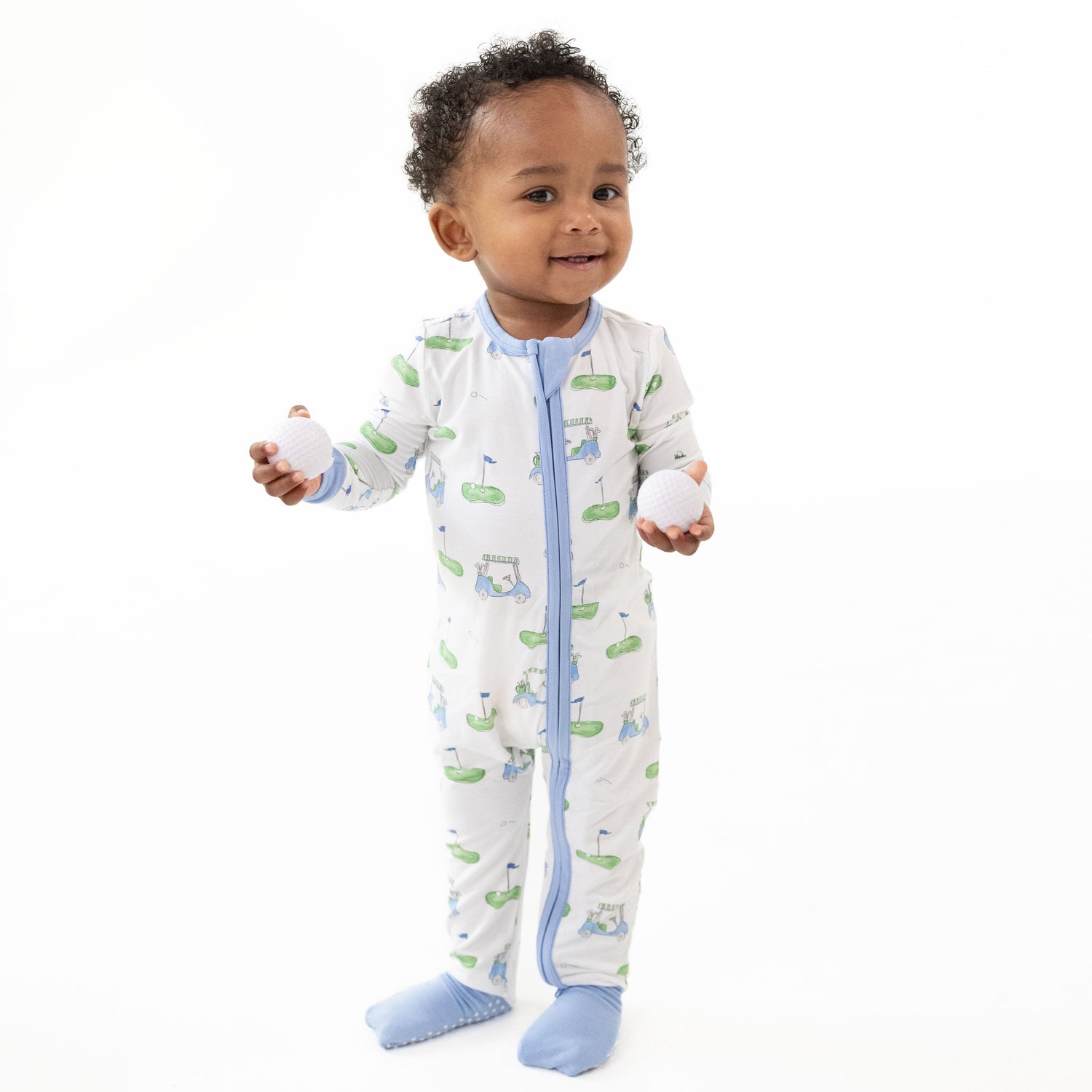 Convertible romper with blue golf cart print, zipper front, and fold-over foot cuffs