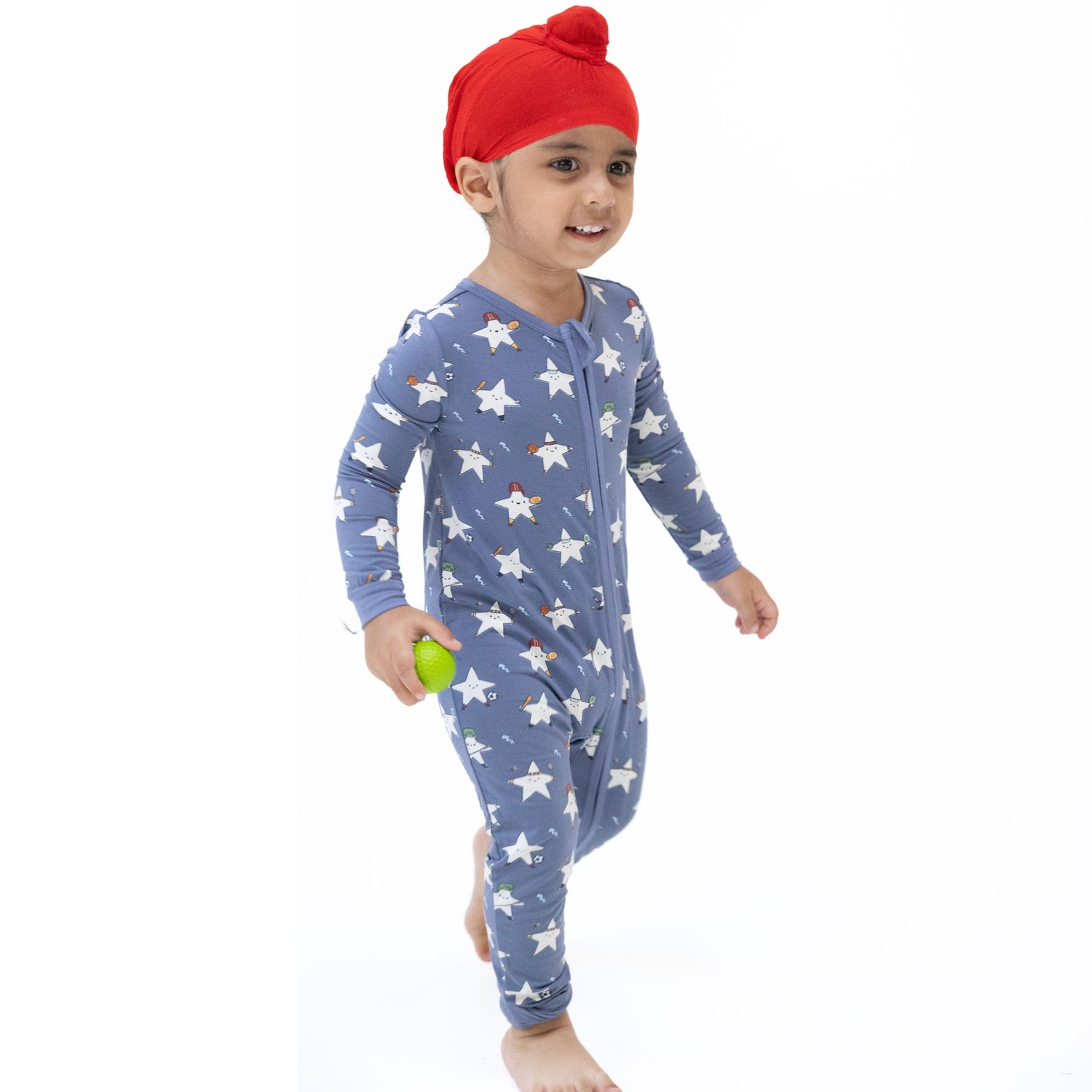 Convertible romper with a glow-in-the-dark sports all-stars print, two-way zipper, and fold-over foot cuffs
