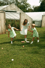 Elouise Dress Celery Terry Cloth Short Sleeve Collar Button Flared Skirt Kids by Crew Kids NY at Everetts Place