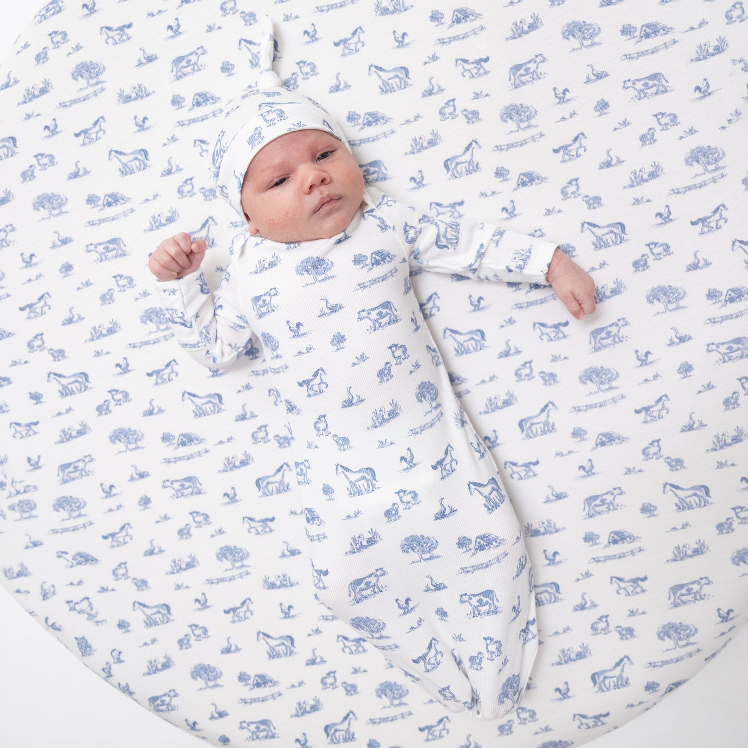 Knotted baby gown and matching knotted hat in a farm friends print on soft ribbed fabric
