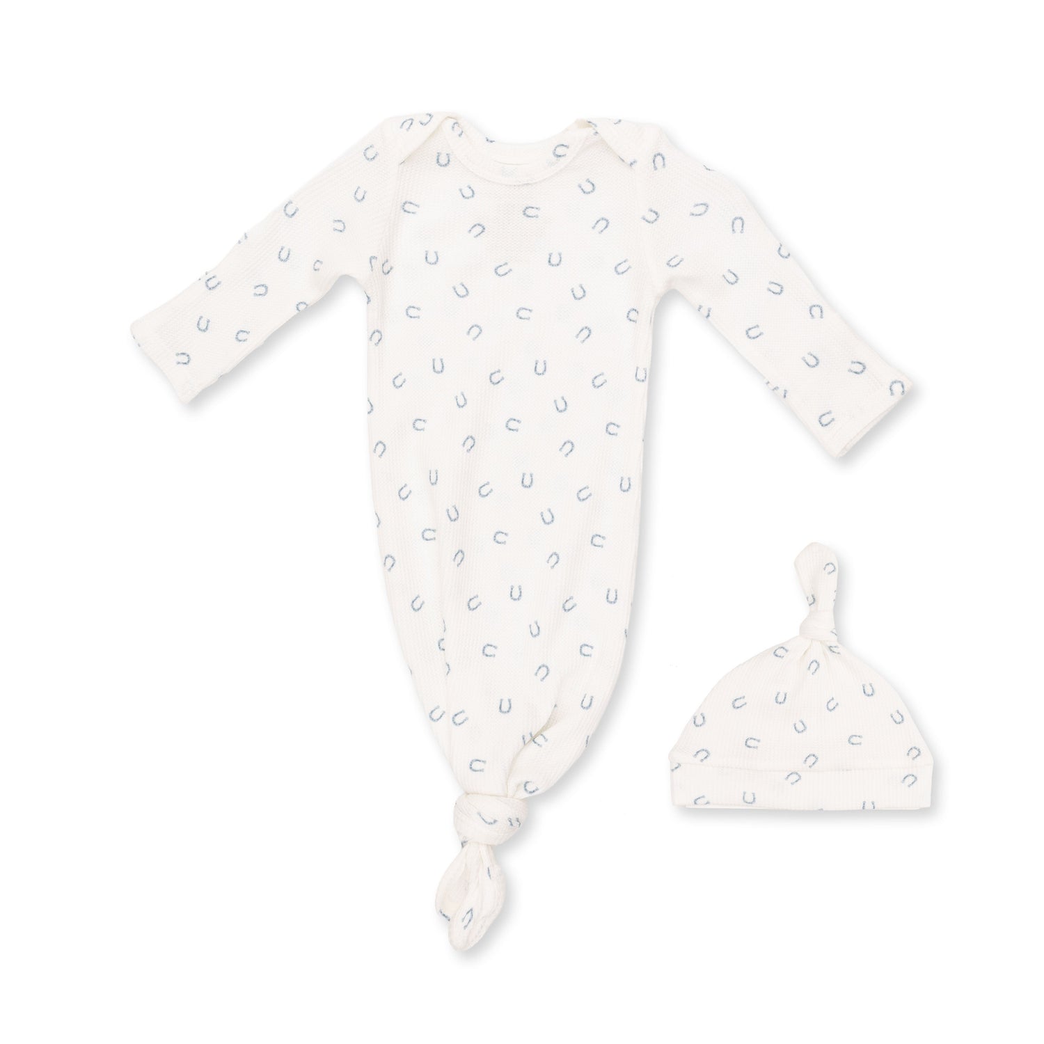 Knotted baby gown and matching knotted hat in blue waffle fabric with a little horseshoes print