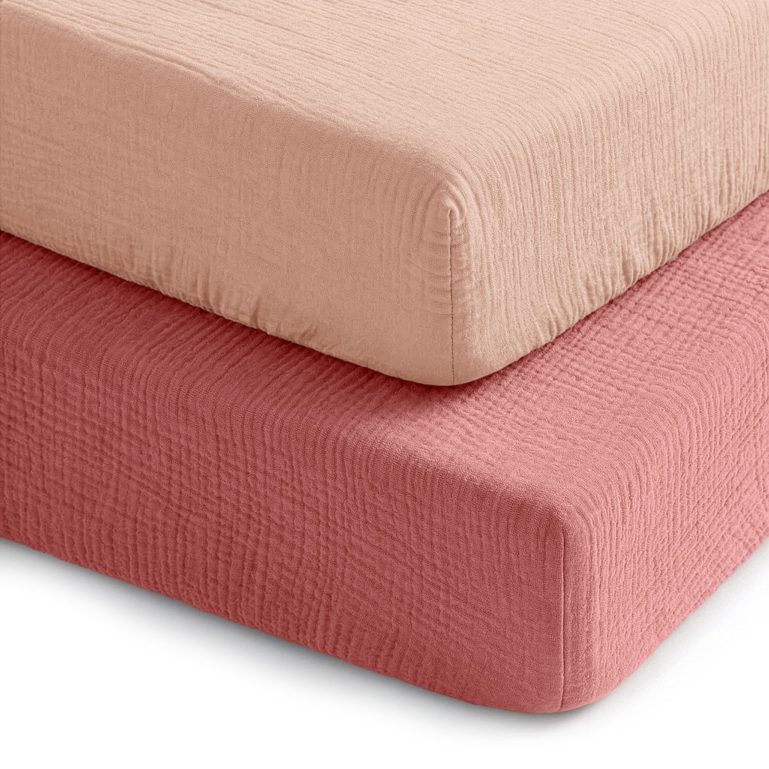 Two fitted muslin crib sheets in dusty rose and blush
