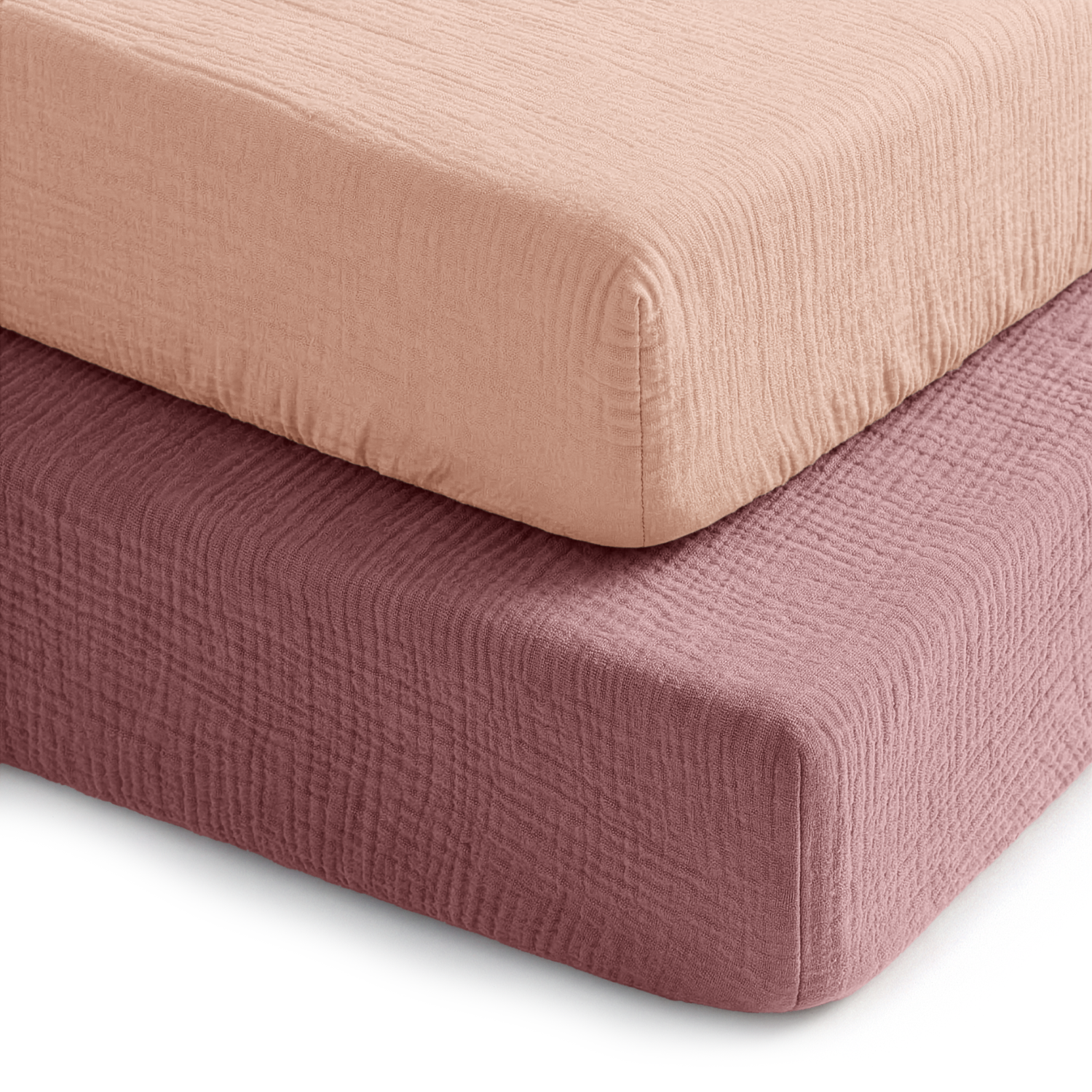 Two muslin fitted crib sheets in mauve and blush