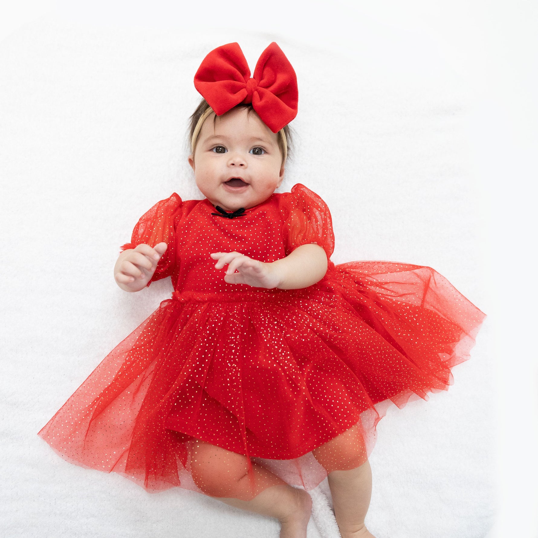 Red velour puff sleeve baby dress with sparkly tulle overlay, chest bow and matching bloomer