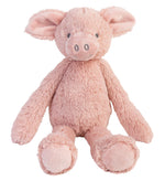 Soft stuffed pig toy with a smiling face, standing upright