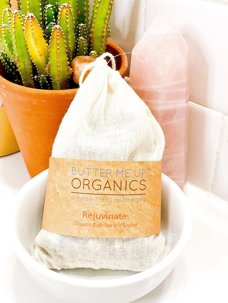Organic Rejuvenating Bath Tea or Sachet with aromatic herbs in muslin bag, ideal for uplifting baths and sachets.