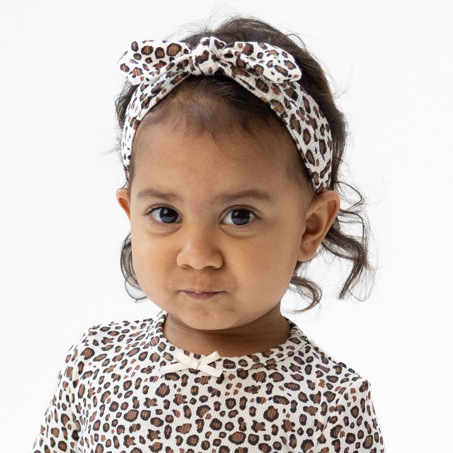 Baby knot headband in ribbed leopard print with a knot detail at the top