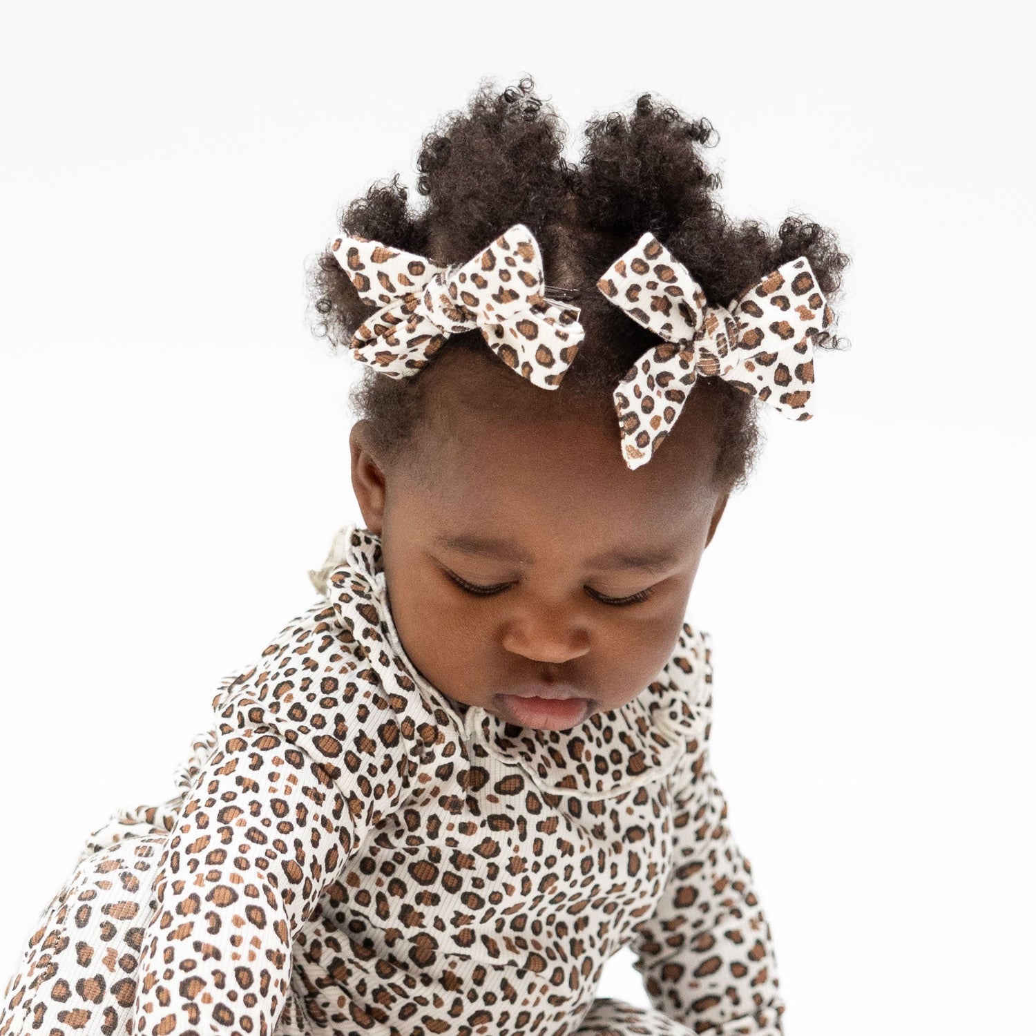 Two ribbed modal bow hair clips in a leopard print pattern