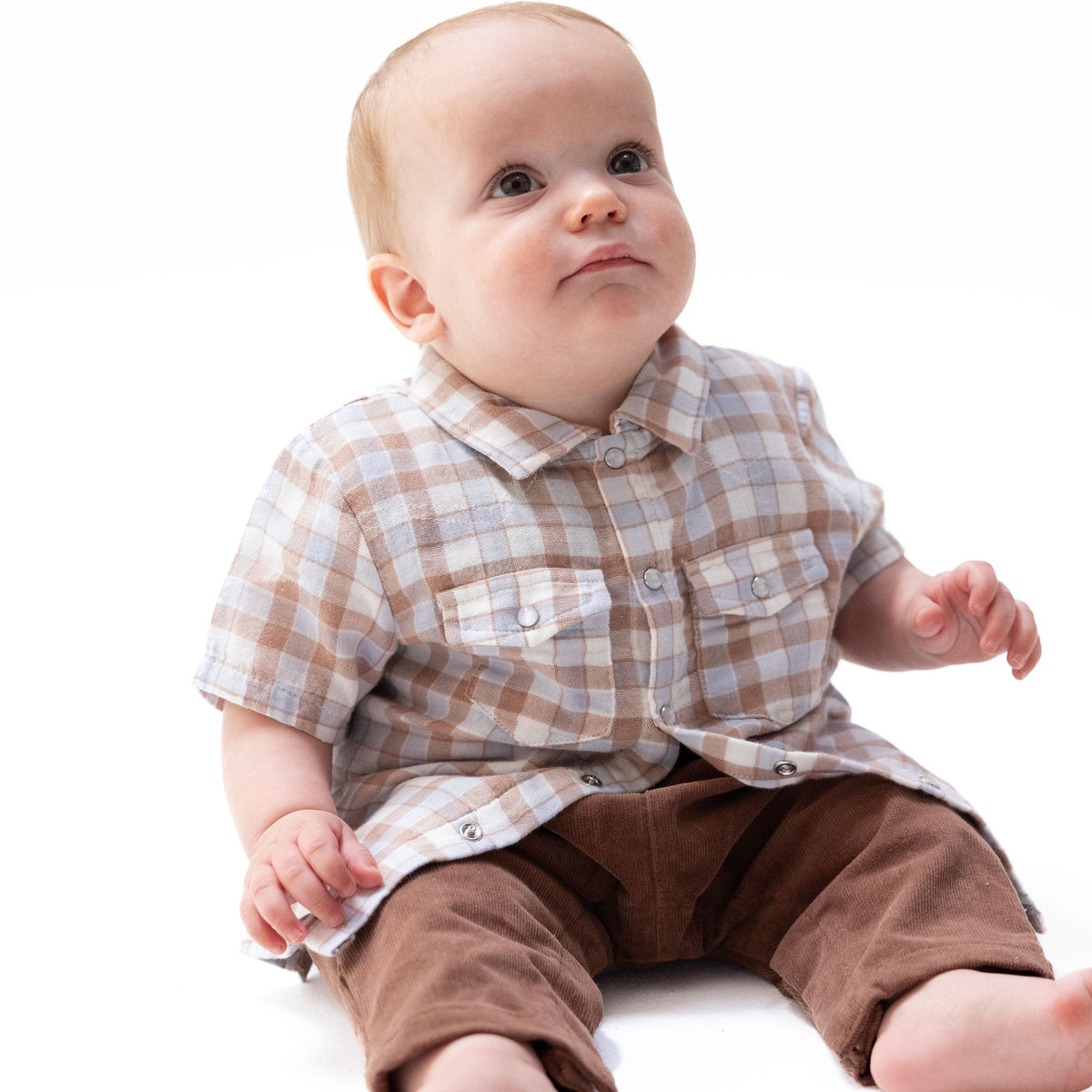 Short sleeve baby shirt in western plaid organic cotton muslin with a pearl snap button front