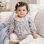 Baby bodysuit in blue and cream vintage floral print with scalloped lace collar and ruffled leg hems