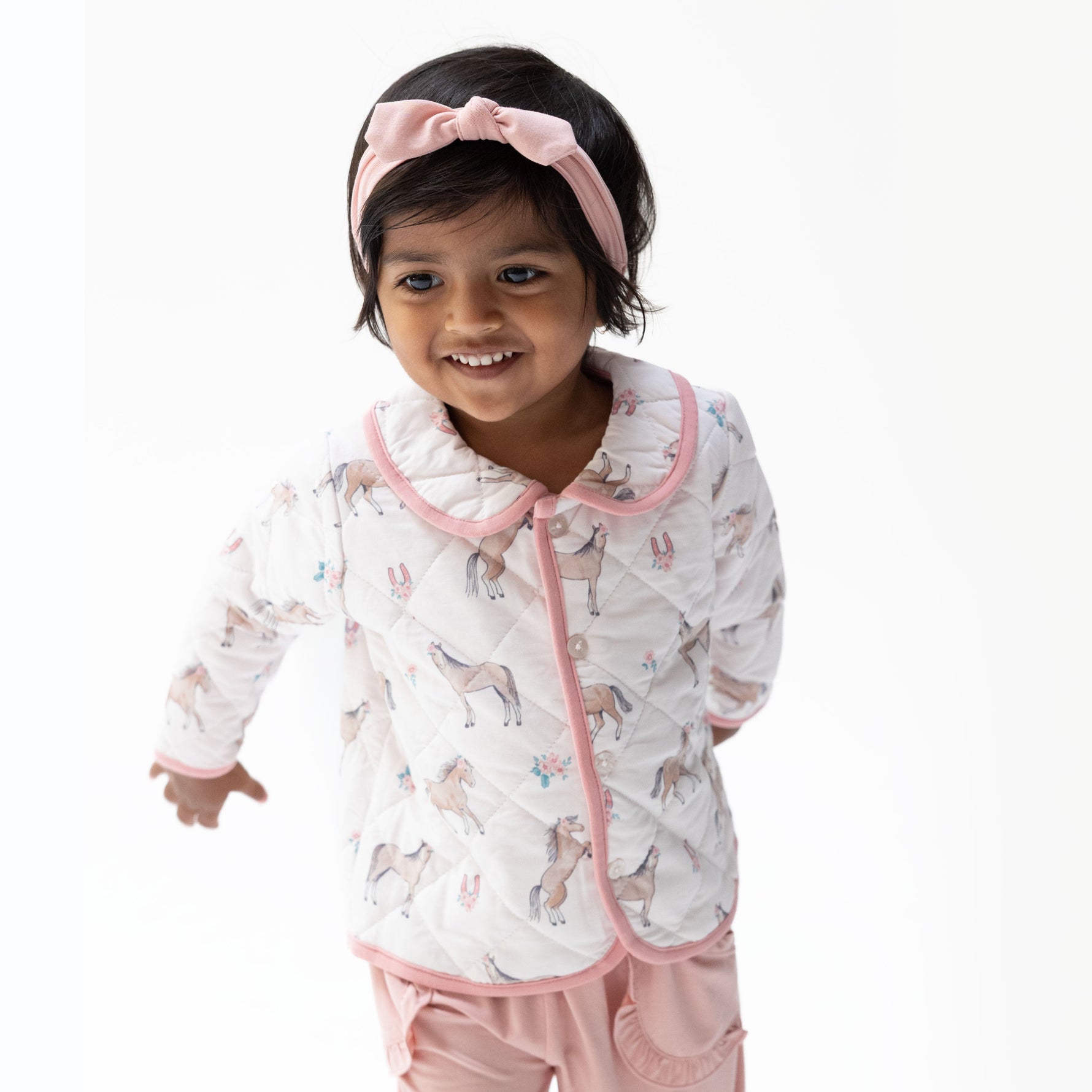 Baby barn jacket with contrast collar and trim, snap front closure, and two front pockets