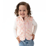 Sleeveless baby zip vest in a Southwest-inspired print with a full front zipper and zip pocket.