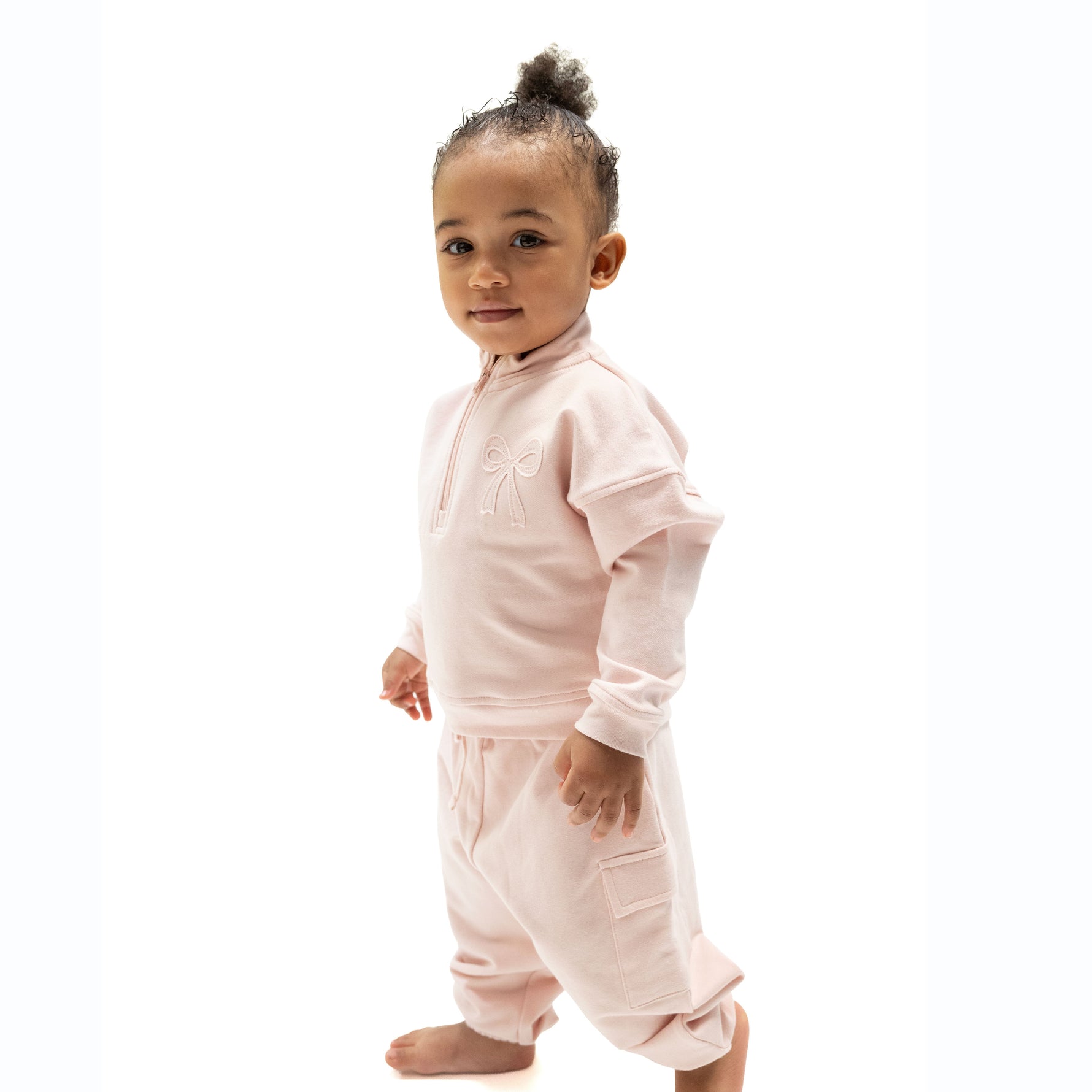 Veiled pink cargo pants with functional pockets and pull-on waist