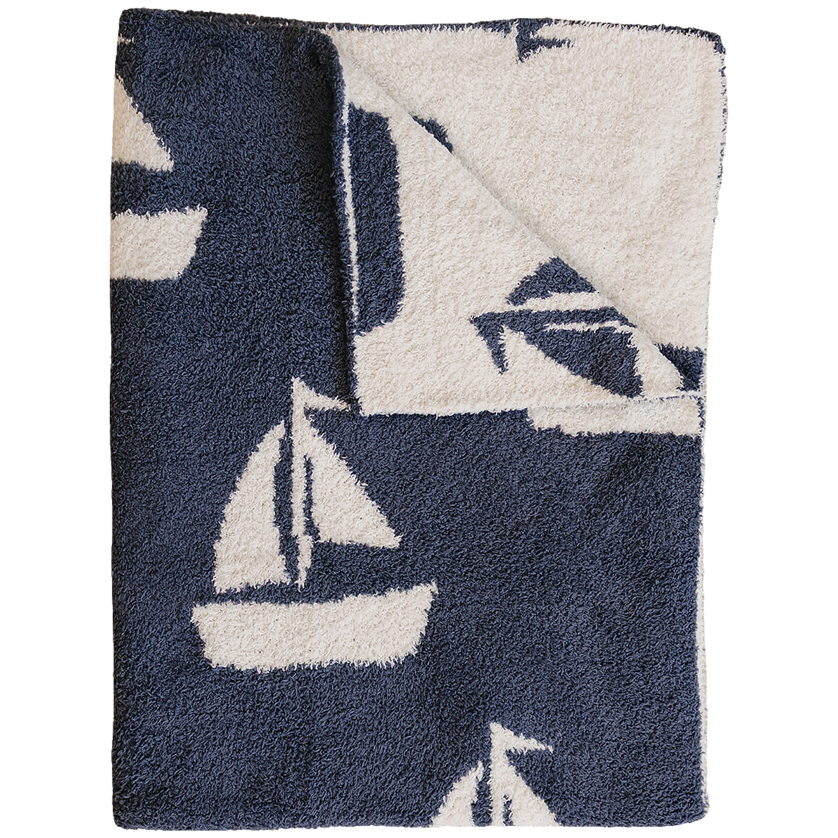 Plush blanket with a sailboat pattern