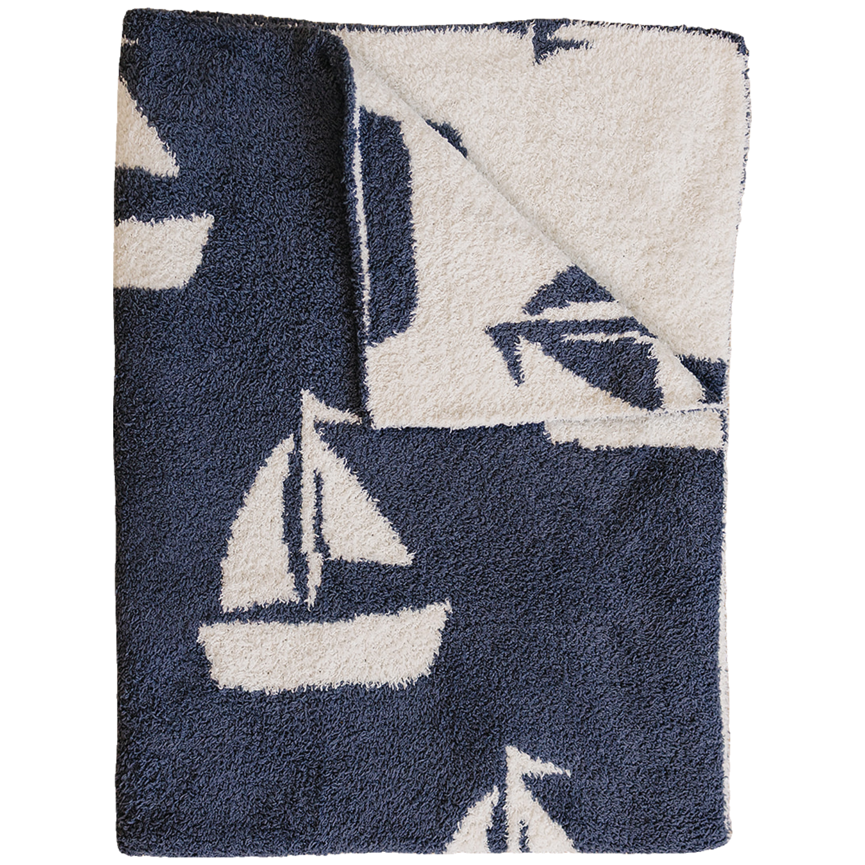 Plush blanket with a sailboat pattern