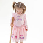 Tutu skirt with tulle overlay, sequin golf cart and bow appliques, sparkle waistband, and bamboo bike shorts underneath