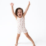 Angel Dear Tumble Suit, a one-piece baby romper in stretchy poly jersey activewear