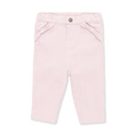 Veiled pink corduroy baby pants with a front pocket trimmed with a small bow