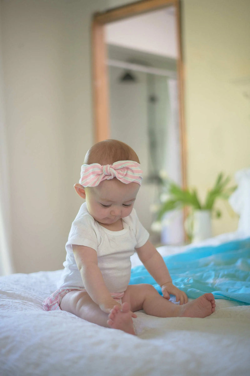 Cute baby wearing Candy Stripe Ruffle Bamboo Bloomer and Headband Set.