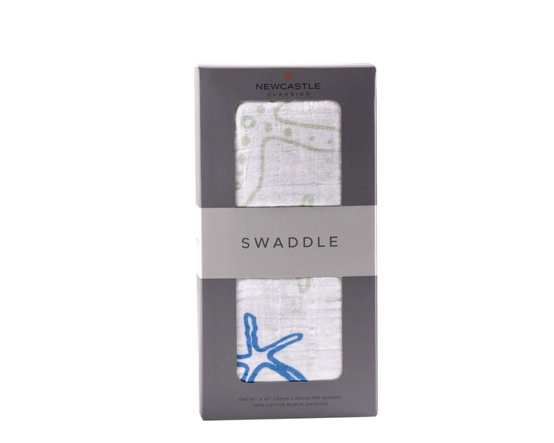 Newcastle Classics - Starfish Swaddle in packaging, breathable cotton muslin fabric.