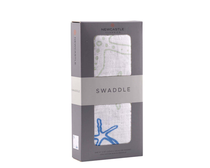 Newcastle Classics - Starfish Swaddle in packaging, 100% natural cotton muslin.