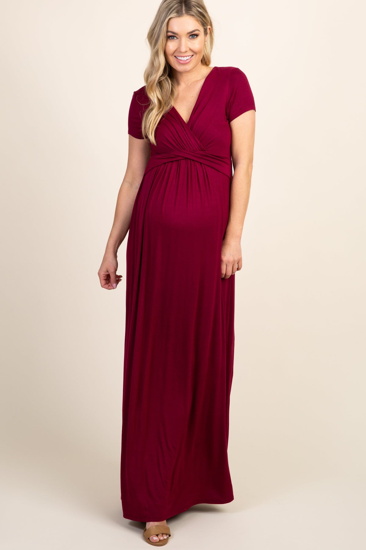 Burgundy draped maternity and nursing maxi dress with a nursing-friendly neckline and floor-length skirt.