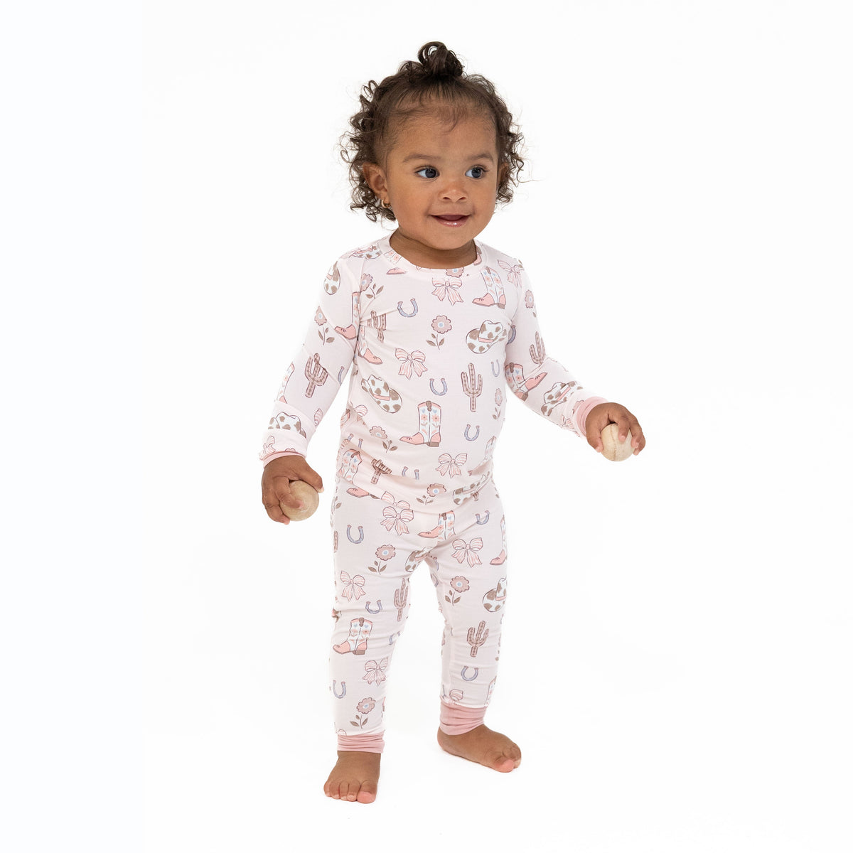 Two-piece long sleeve loungewear set with a cowgirl boots and bows print