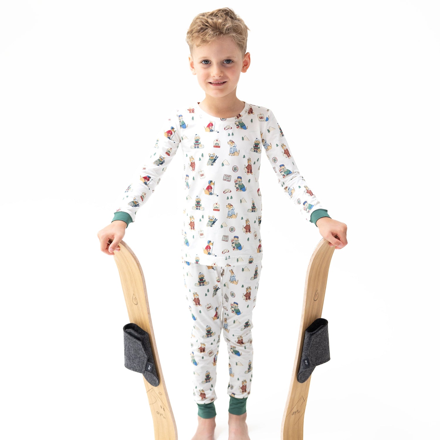 Two-piece long sleeve loungewear set in green with a winter sports dogs pattern, matching top and pants.