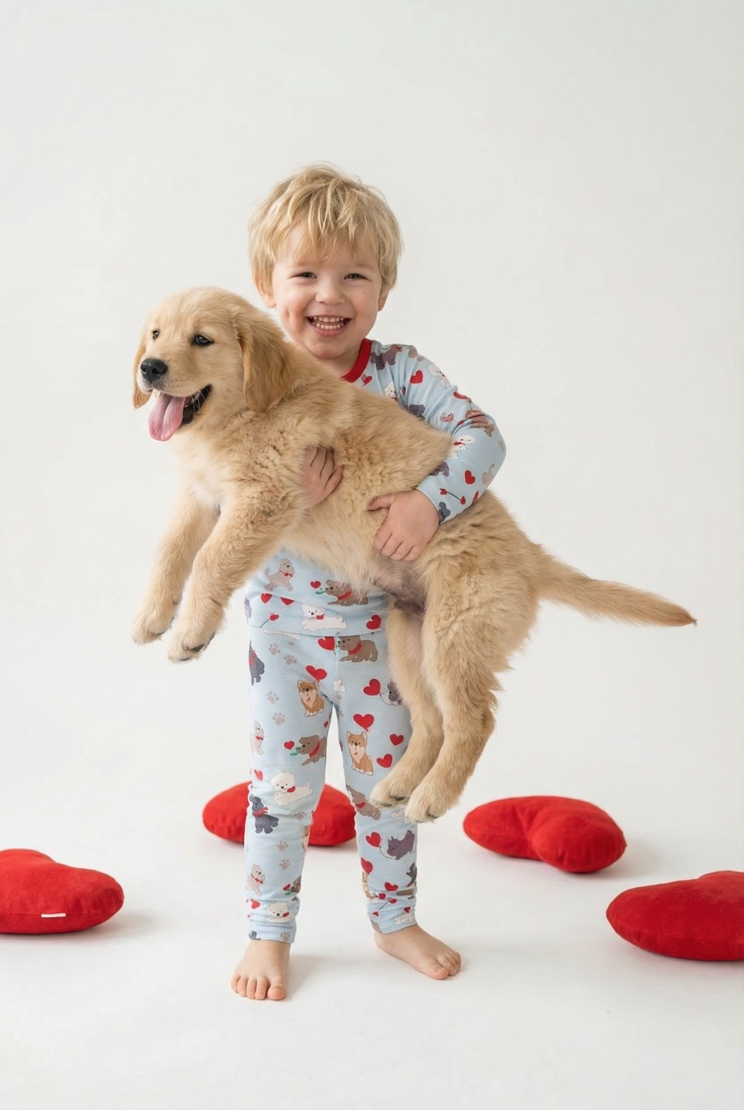 Long sleeve baby pajamas in a puppy print with a soft neutral background