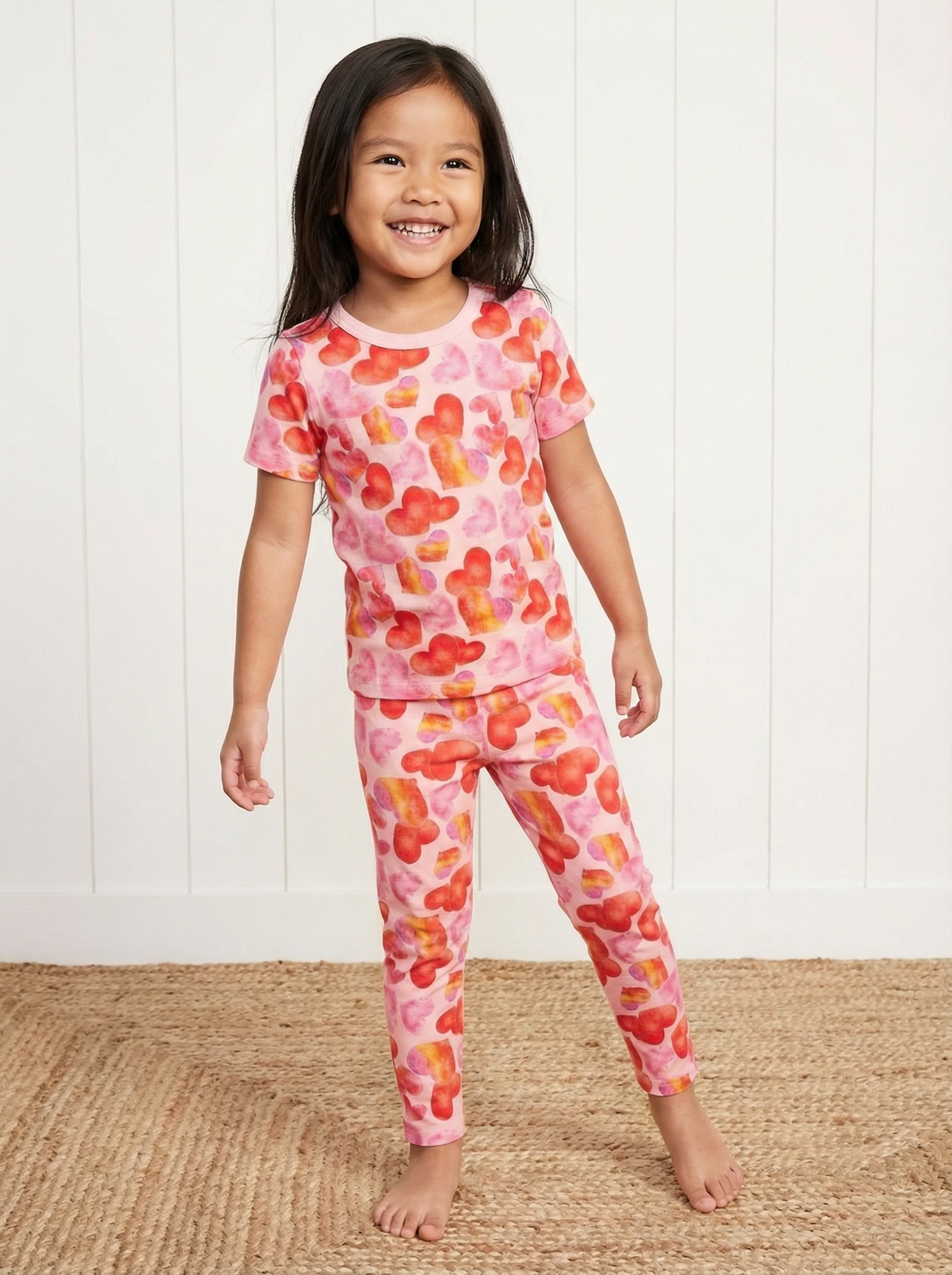 Short-sleeve baby pajama set with an all-over love hearts print, matching top and pants