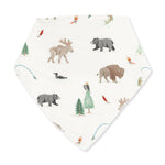 Bandana bib printed with a Northern Woodland animals pattern, with snap closure at the neck