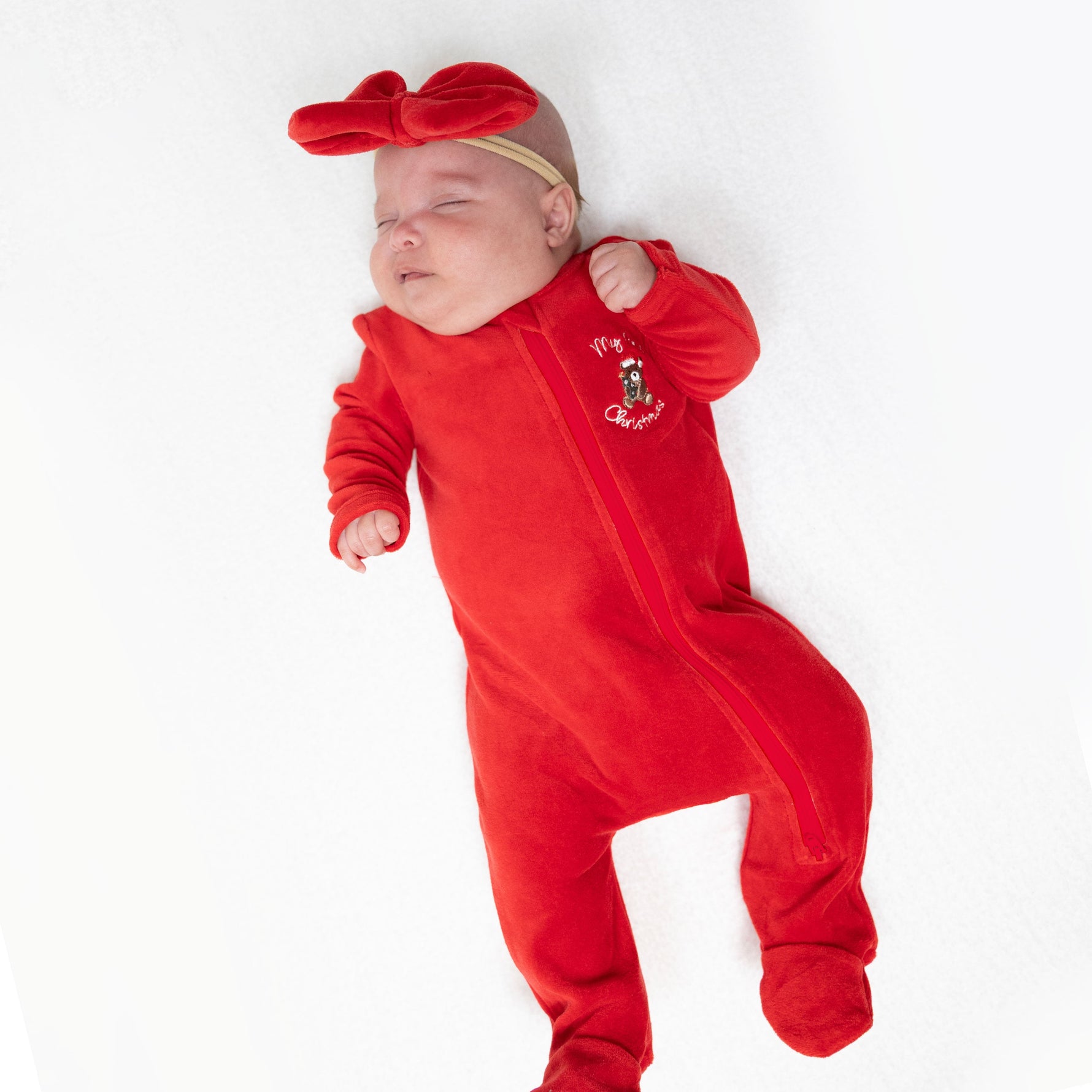 Baby velour footie pajama with My First Christmas teddy bear embroidery, footed legs and full-length snaps