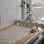 Soft Mushie organic changing pad liners for comfortable baby changes.