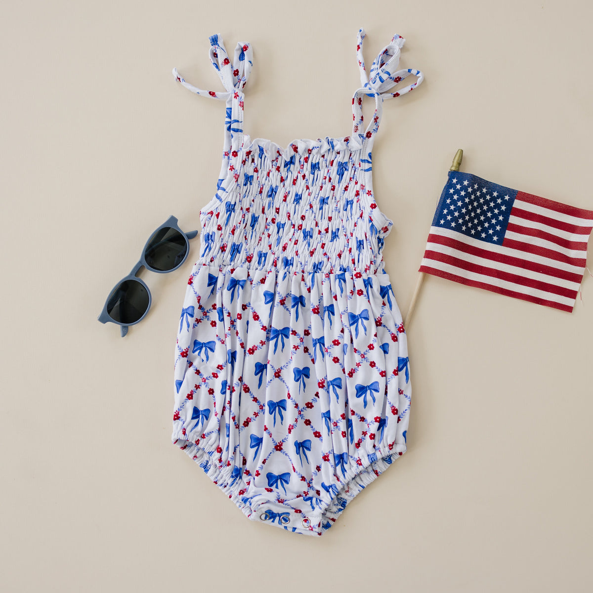 Smocked Red, White and Bows Bamboo Bubble Romper by Little Joy Co. at Everetts Place