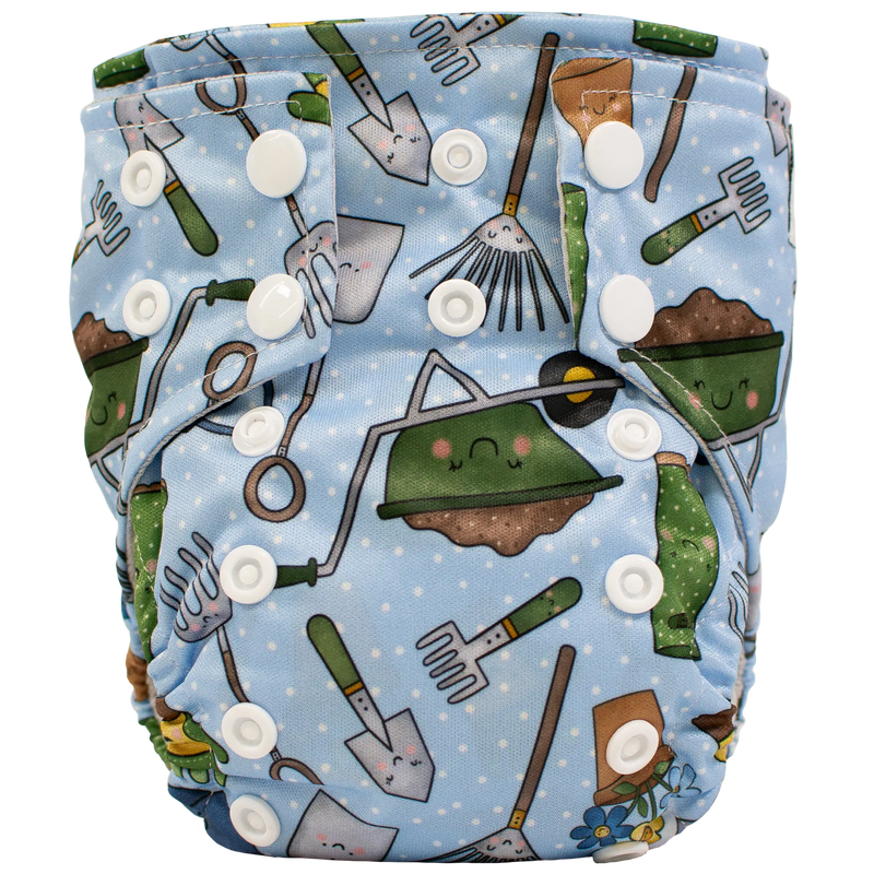 Tiny Tushies Newborn AIO cloth diaper with gardening print and adjustable snaps.