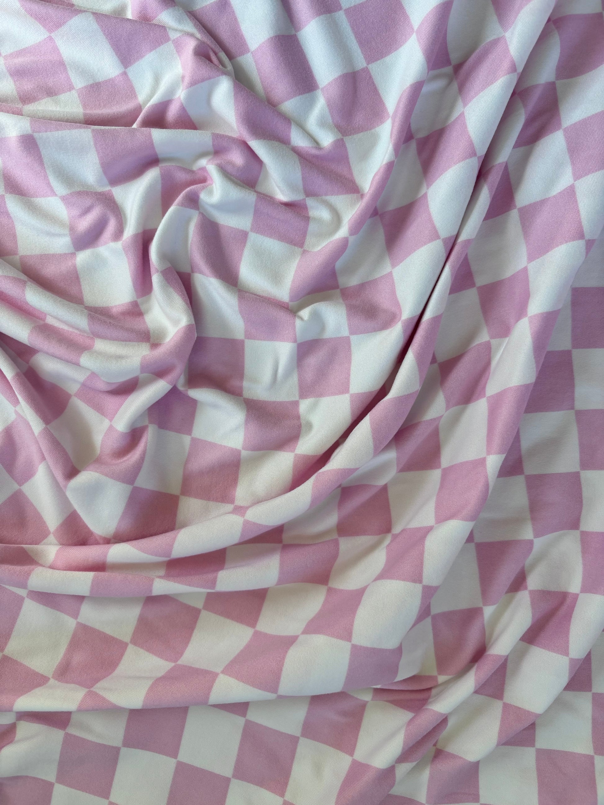 Sugar Pink And White Checkered Stretch Swaddle For Newborn Little Mae & Co Everetts Place: Online Boutique