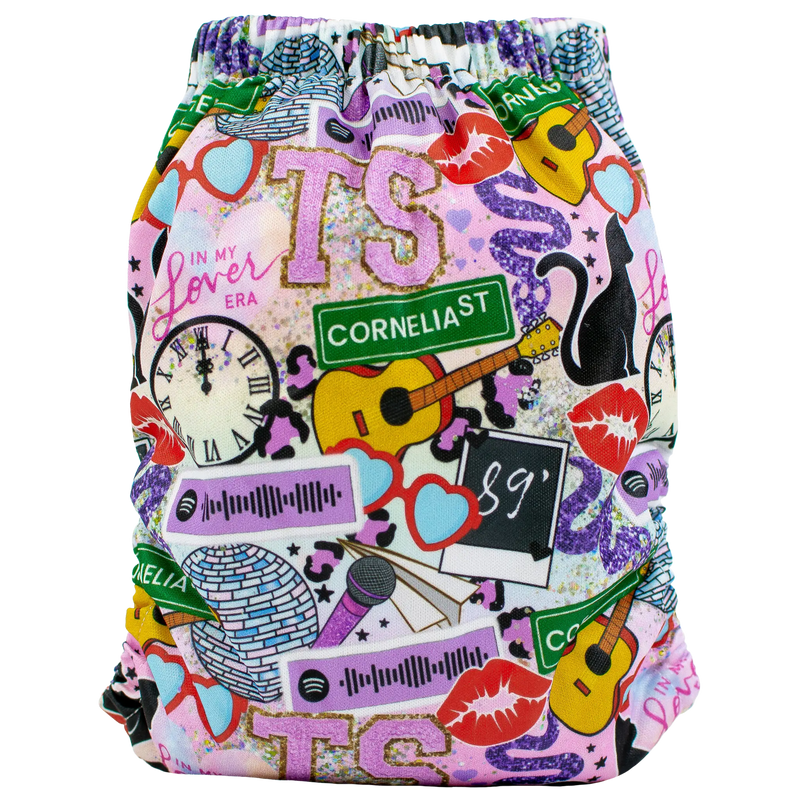 Slim Fit Pocket Cloth Diaper with colorful music-themed design, adjustable snaps, and wide pocket opening.