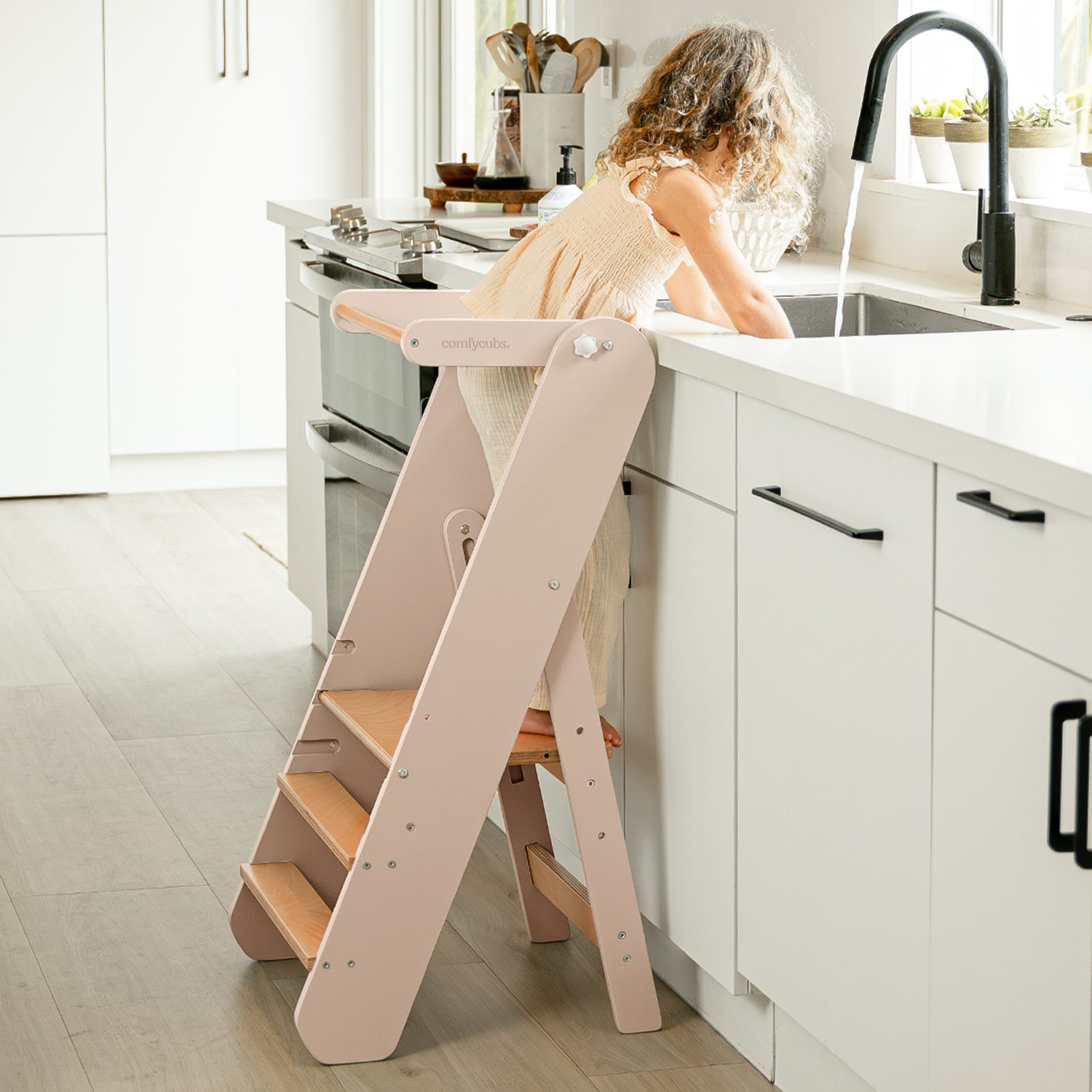 Adjustable wooden toddler helper tower step stool in blush, folding design with steps