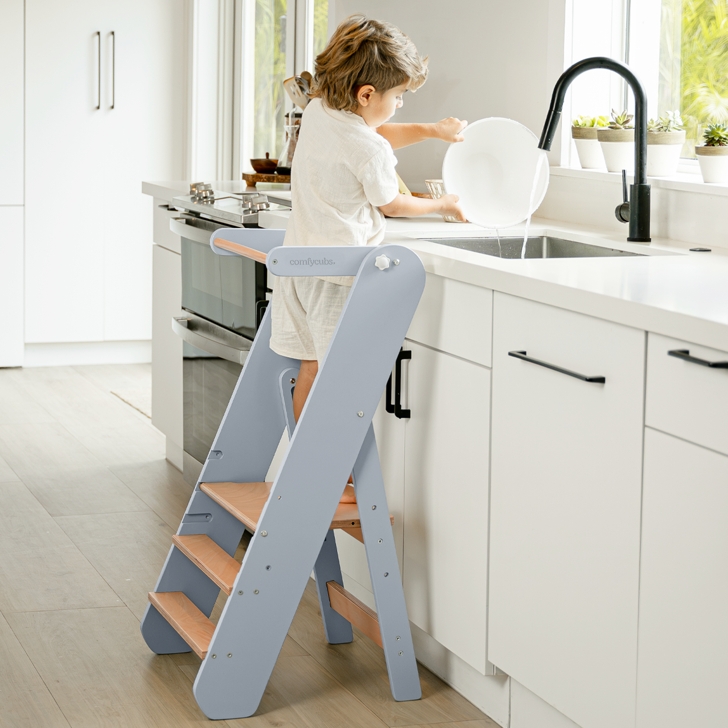 Foldable toddler helper tower step stool in Pacific blue with three adjustable height levels