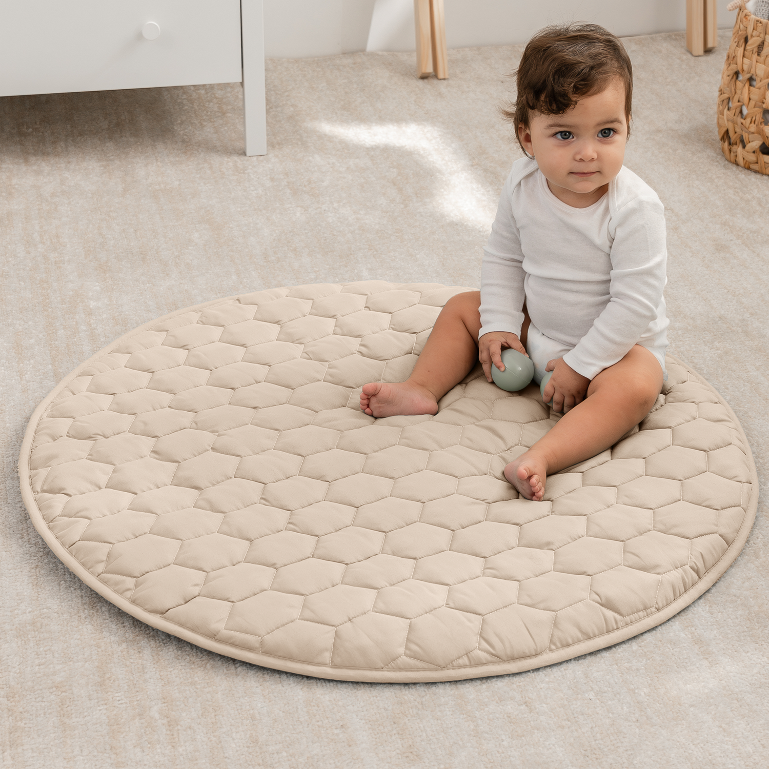 Quilted plush play mat for baby in sand with a non-slip bottom