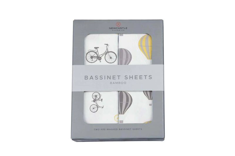 Newcastle Classics vintage bicycles and hot air balloon bassinet sheets in gray packaging.