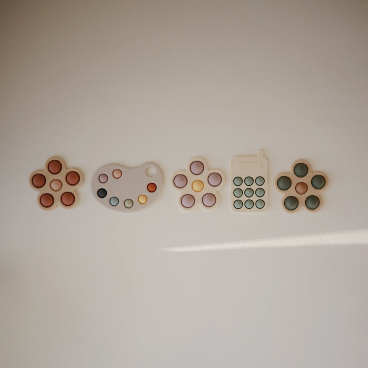 Silicone Phone Press Toy by Mushie