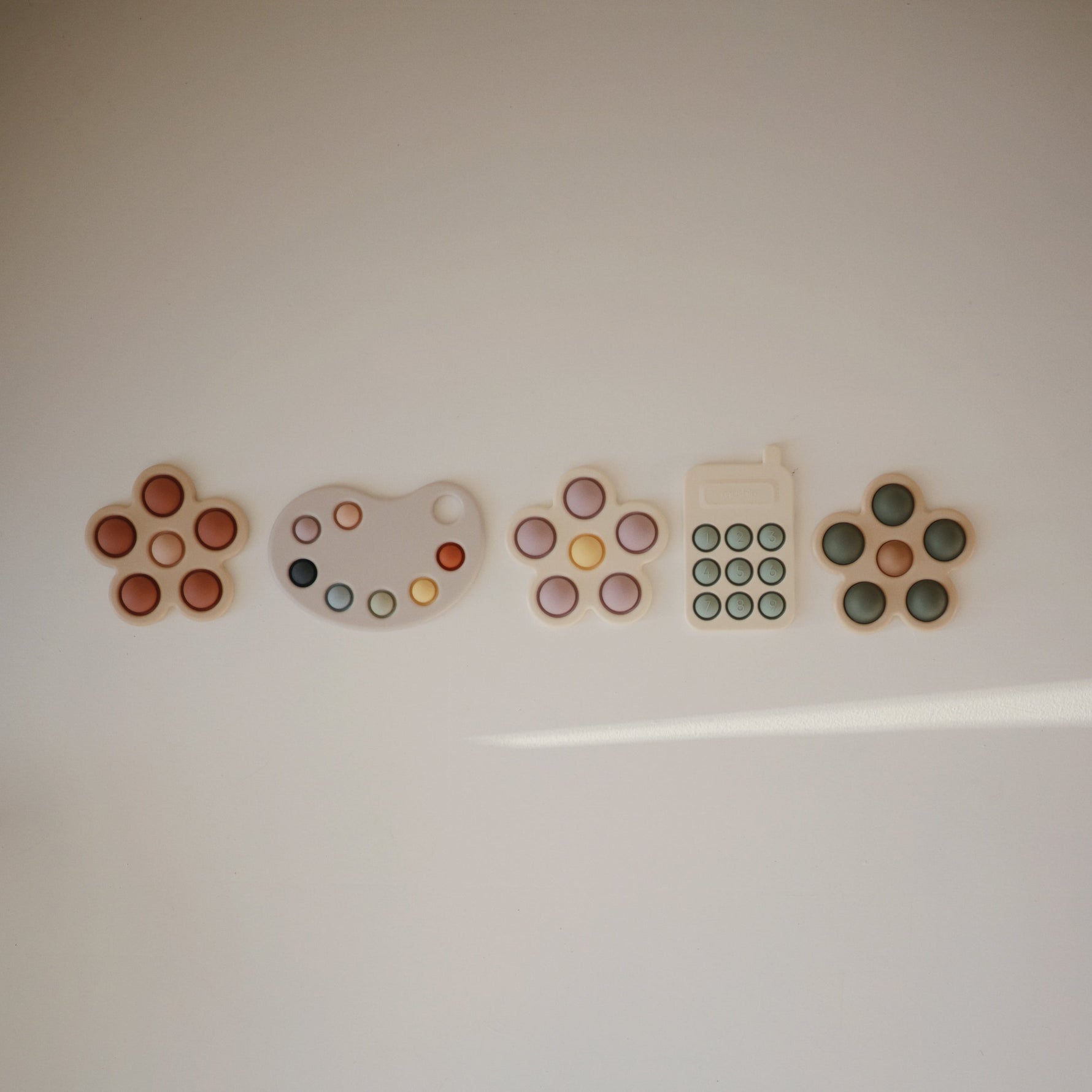 Silicone Phone Press Toy by Mushie