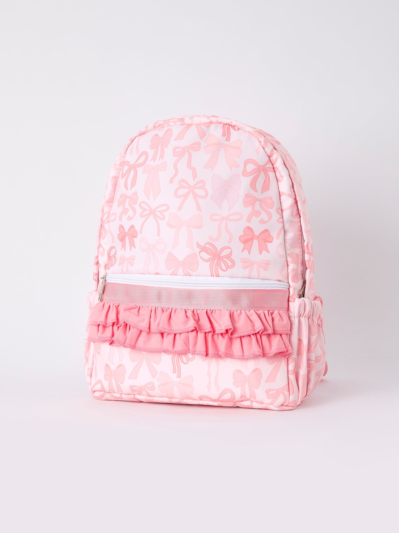 Pink backpack with a bow design on the front and a top handle