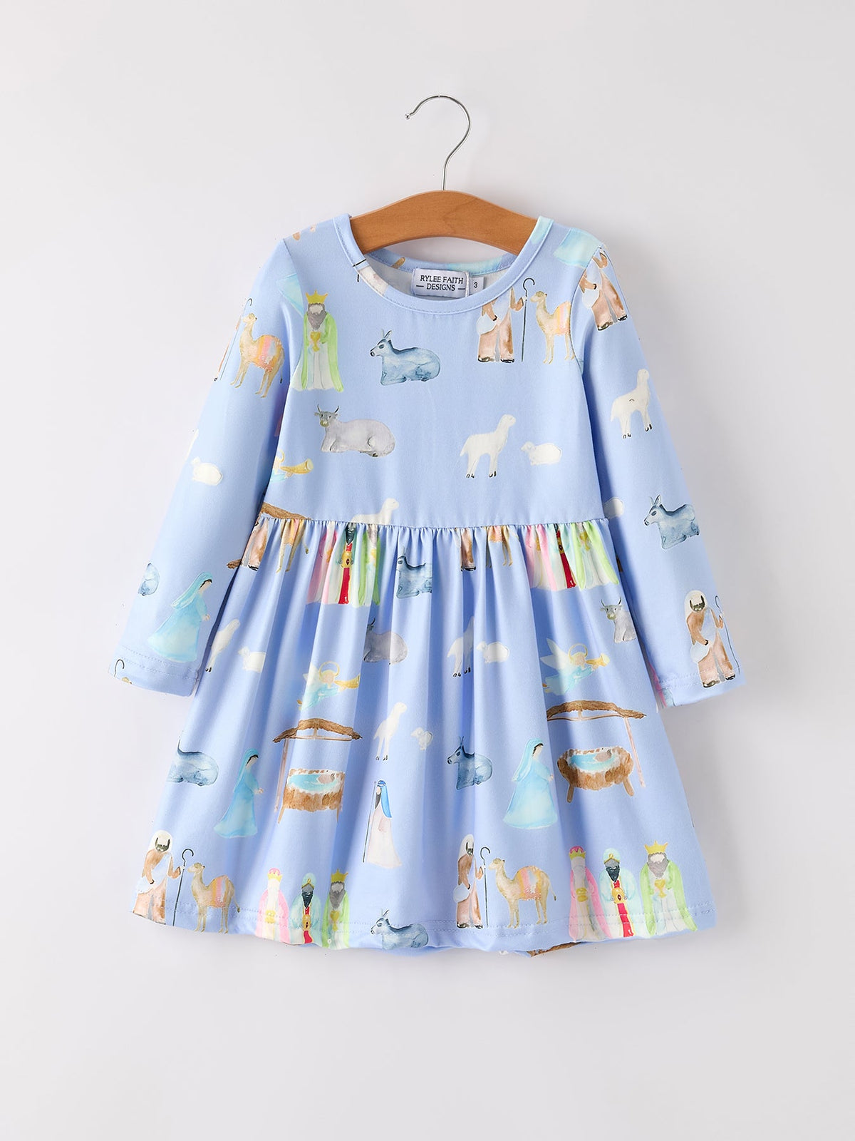 Girls long sleeve dress with a Christmas nativity scene print in winter holiday colors