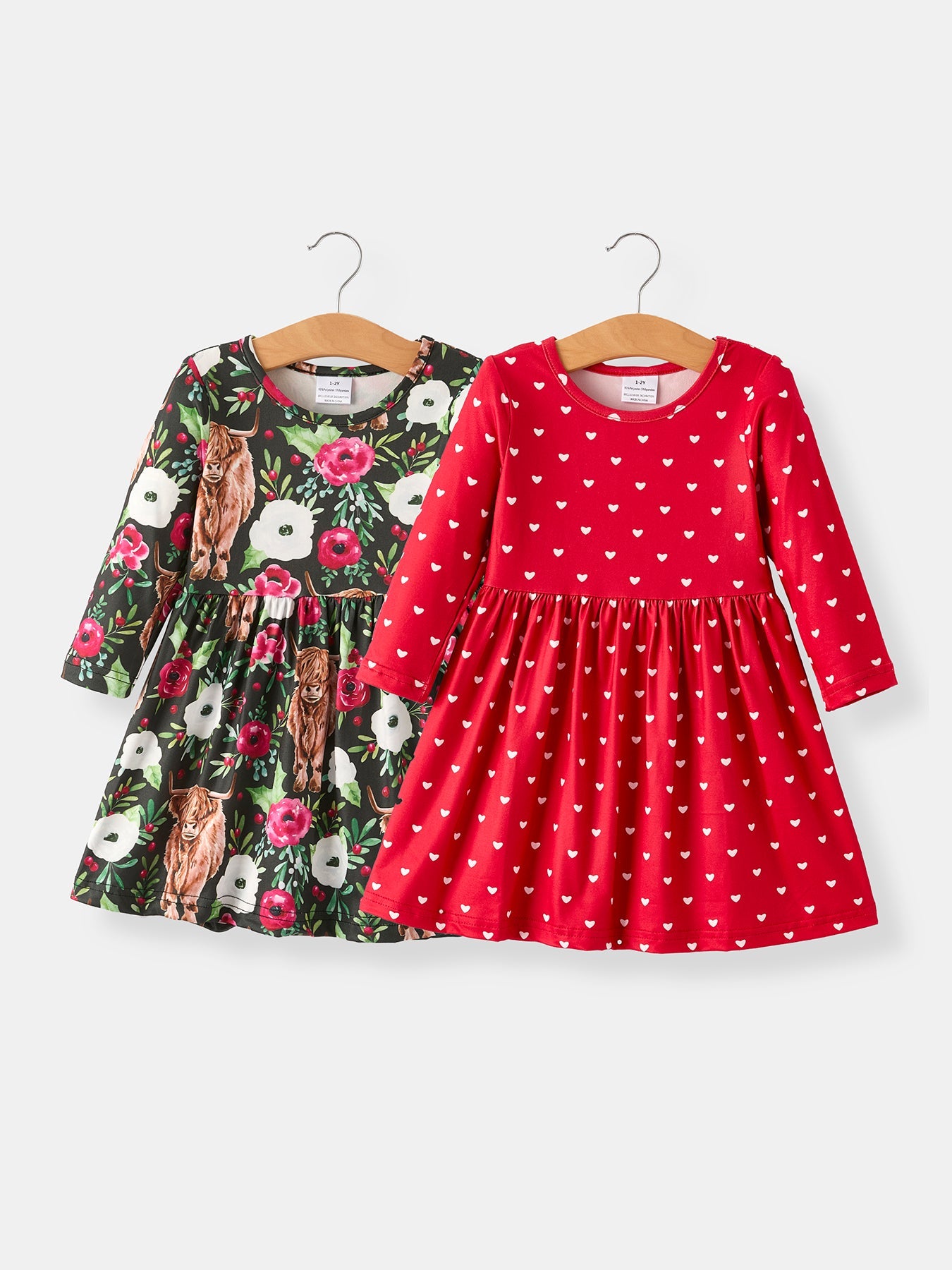 Two-piece girls dress set in a winter Christmas print, shown as coordinating top and skirt pieces